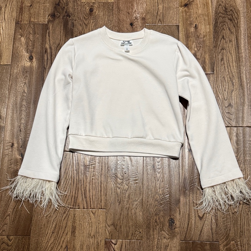 Blush cropped sweatshirt with feather trim. Sz S